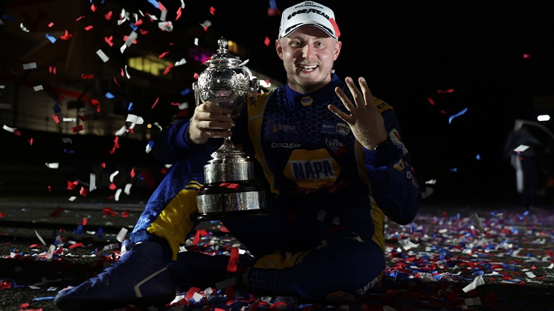 Ash Sutton holds up four fingers after winning 2023 BTCC championship