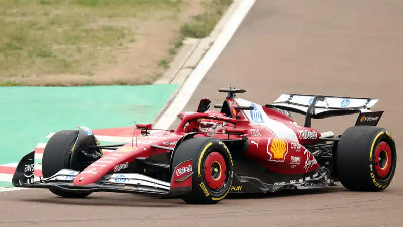 Charles Leclerc waves to the crowds at Fiorano during shakedown of 2025 Ferrari F1 car