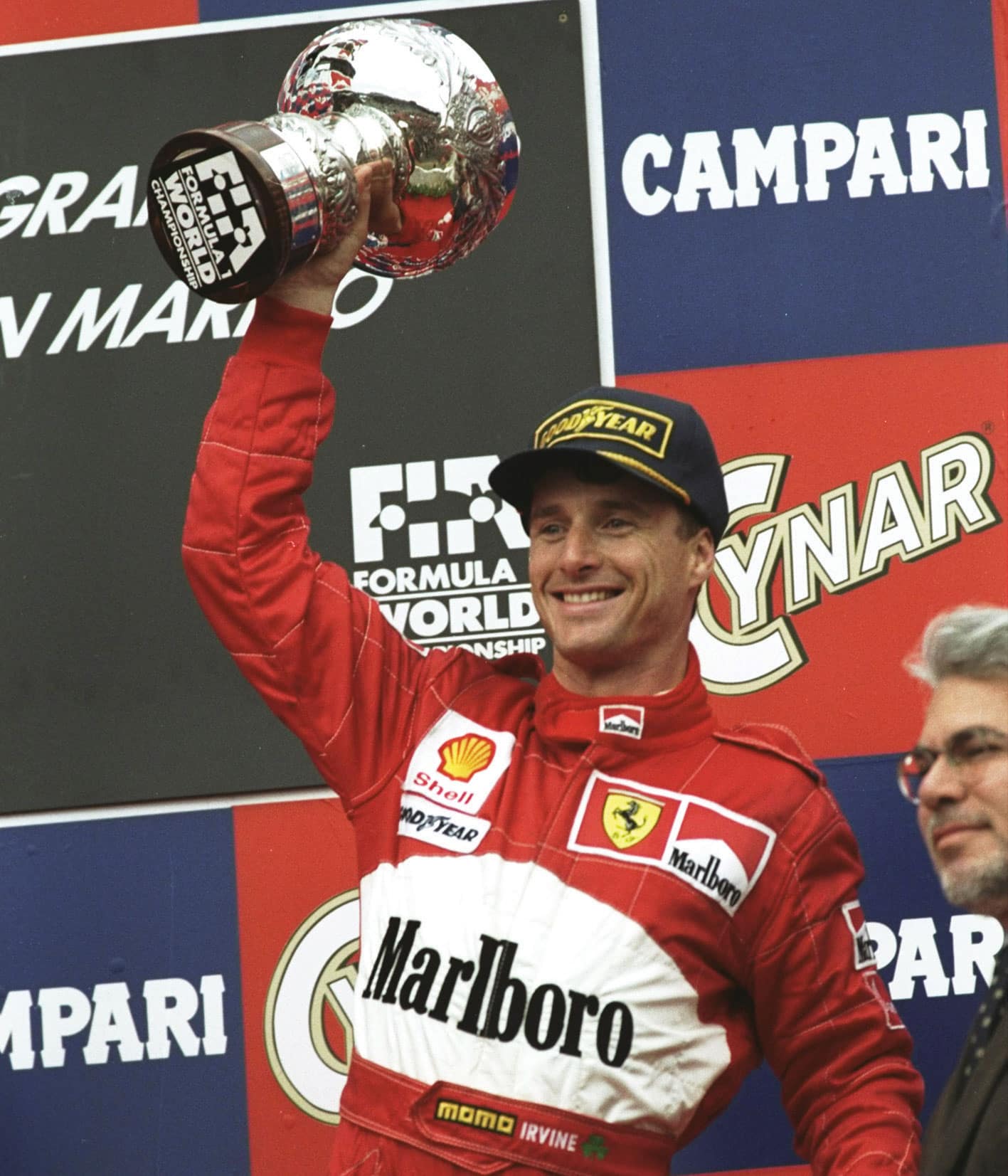 Eddie Irvine holds up trophy