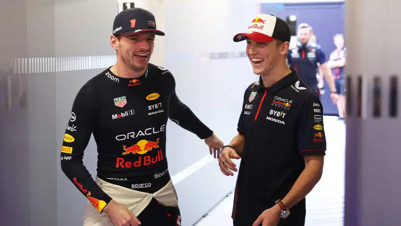 Liam Lawson with Max Verstappen in Red Bull pit gaarge during 2023