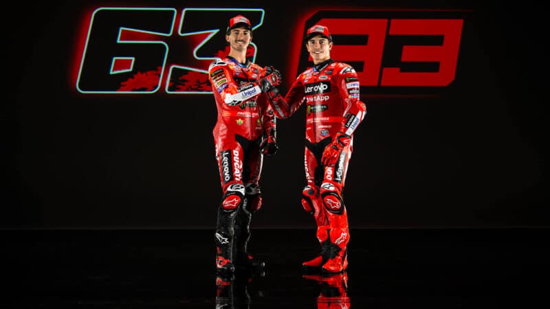 Pecco Bagnaia stands next to Marc Marquez