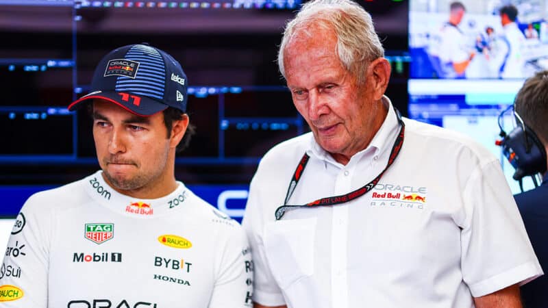 Sergio Perez with Helmut Marko in Red Bull F1 pit garage