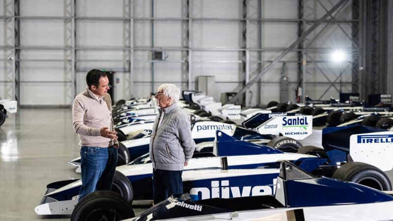 Tom Hartley Junior talking to Bernie Ecclestone with Brabham F1 cars